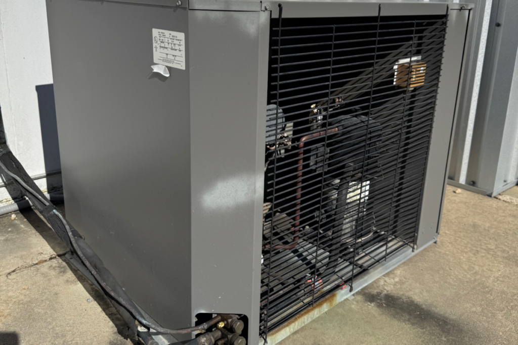 Commercial HVAC condenser unit with visible compressor and cooling components