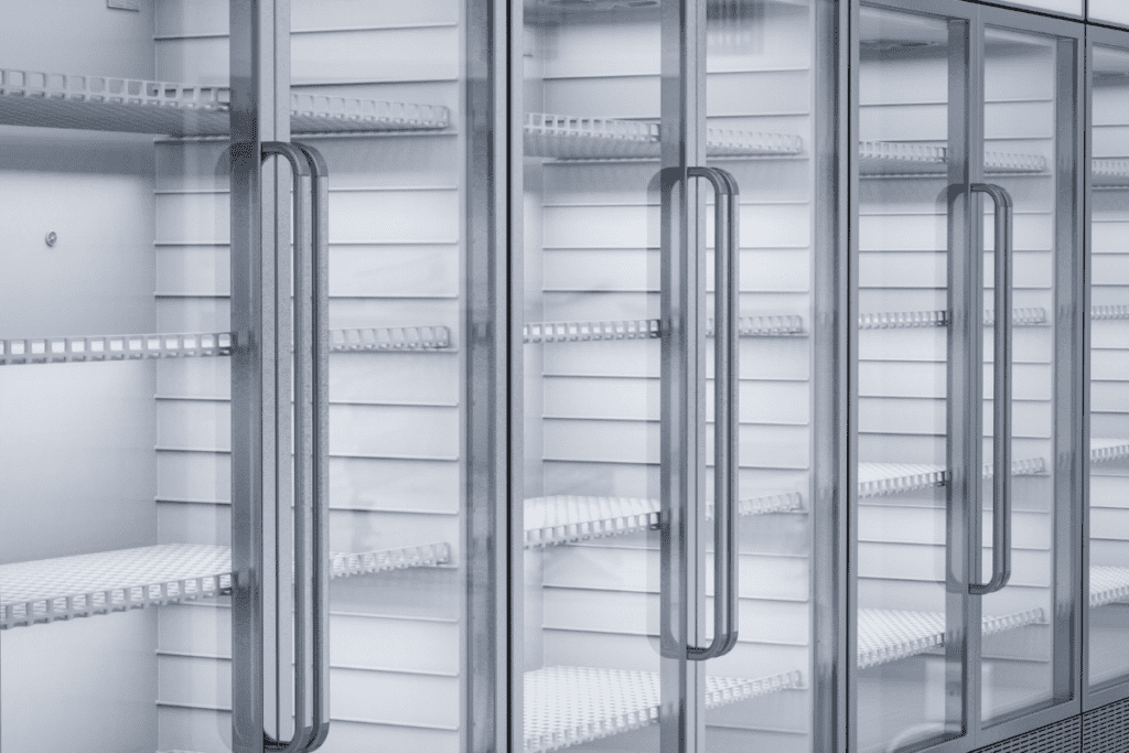 Residential outdoor air conditioning unit installed beside brick home