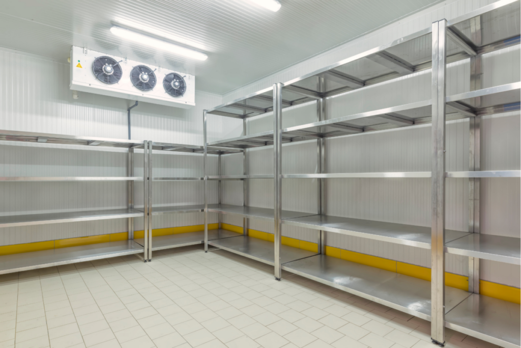 Commercial walk-in freezer with shelving and refrigeration system